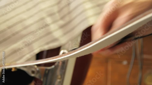 Barber sharpens straight razor, close up