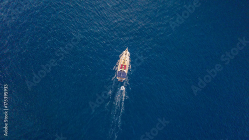 Aerial view of sailing boat on open sea. © Jag_cz