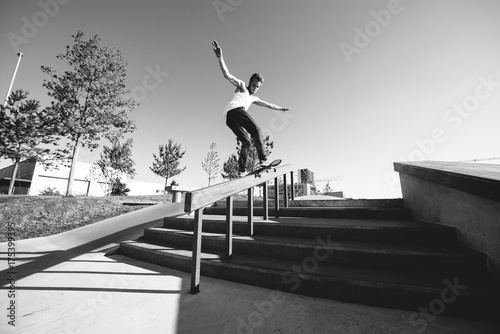 Frontside grind on handrail