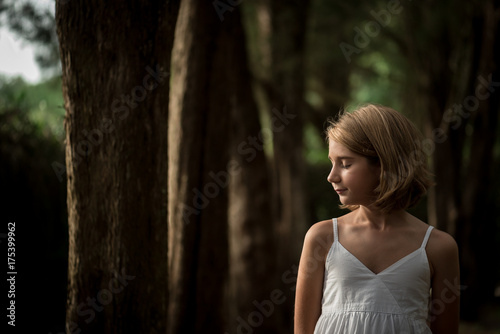 Pre-Teen Girl With Short Hair With Eyes Closed photo