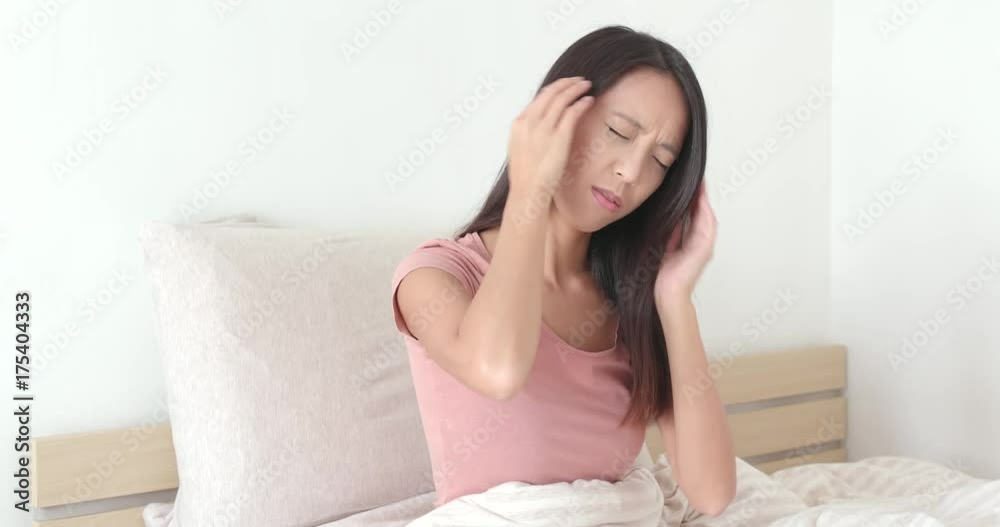 Woman suffer from headache on bed Woman suffer from headache on bed