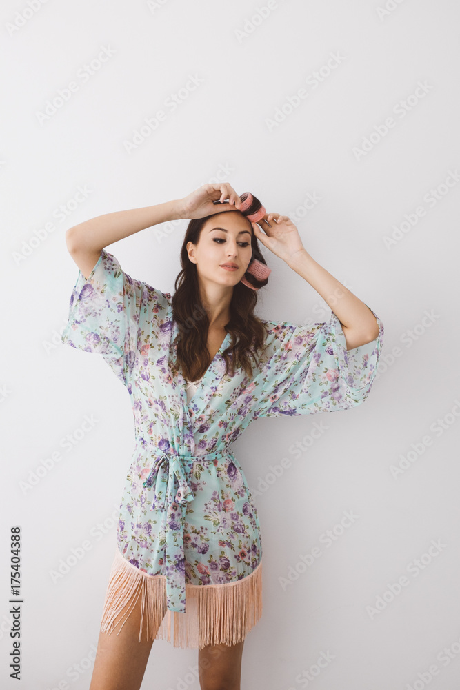 Beautiful Woman Putting Curlers in Her Hair Beautiful Woman Putting Curlers in Her Hair