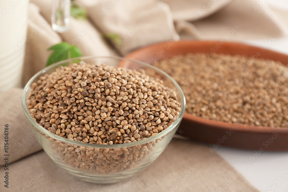 Bowl with hemp seeds on table Bowl with hemp seeds on table