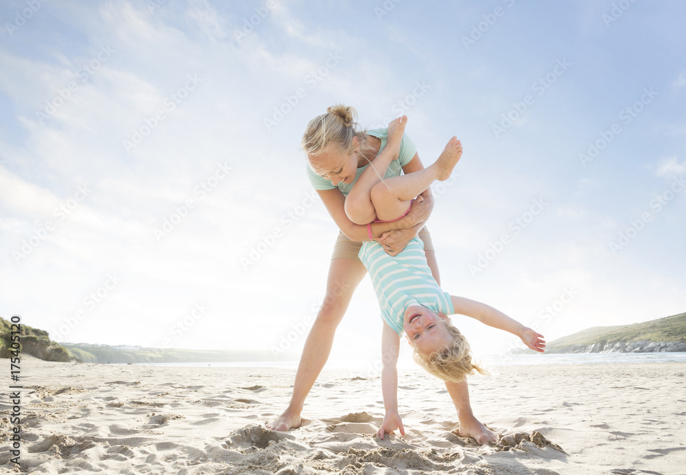 Mother and Daughter on beach in the summertime. Mother and Daughter on beach in the summertime.
