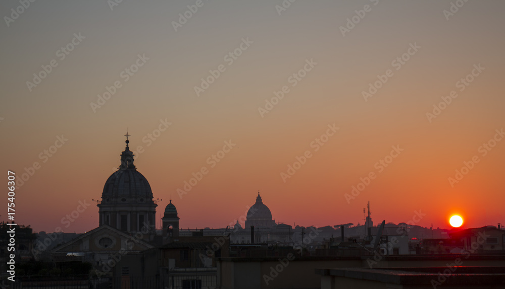 Roman roofs and domes at the sunset / View of Rome cityscape from the roof of so called 
