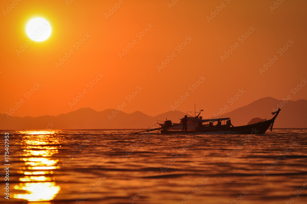 Fishermen in their boat (Long tail) at sunset in Ao Nang