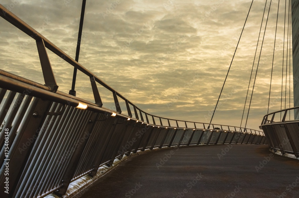 Obraz premium A cable-stayed bridge at sunset over the M20 Motoroway, Ashford, Kent, England