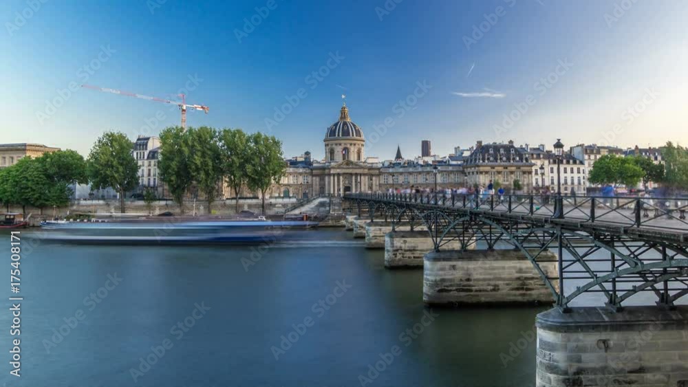 People walk on the Bridge of Arts over the River Seine between the Institute of France and the Louvre timelapse hyperlapse - Paris, France People walk on the Bridge of Arts over the River Seine between the Institute of France and the Louvre timelapse hyperlapse - Paris, France