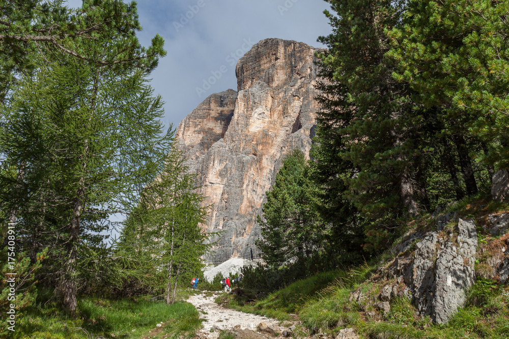 Alpinist towards the southern wall of Tofana di Rozes, Cortina d'Ampezzo, Italy Alpinist towards the southern wall of Tofana di Rozes, Cortina d'Ampezzo, Italy