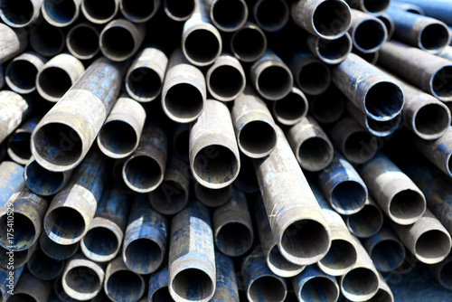 Metal Tubes Stacked in Row Pattern