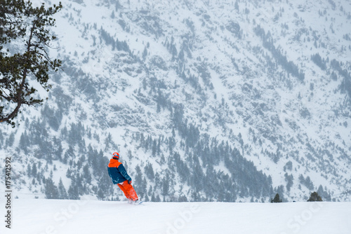 Skier on a snowboard in the mountains of Ordino in Anorra