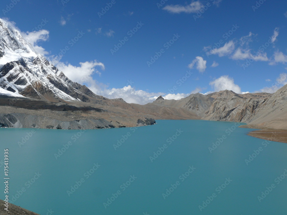 The Tilicho lake and Tilicho peak, beautiful snow capped Himalayas and the highest lake for its size in the world