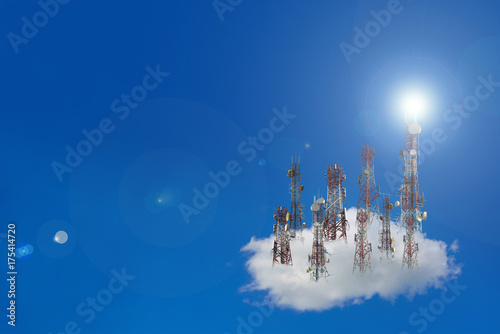 Mobile phone communication antenna tower with the blue sky and clouds