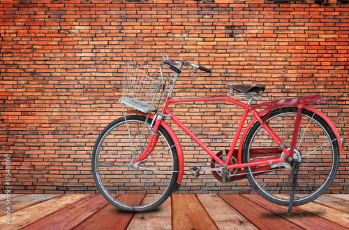 vintage bicycle with old brick wall and copy space.