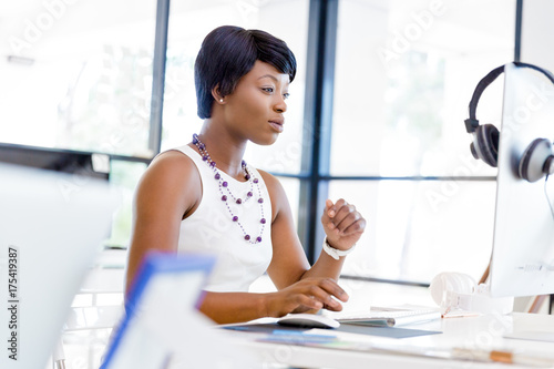 Portrait of businesswoman working at her desk in office Free Download Portrait of businesswoman working at her desk in office - GFXLoad