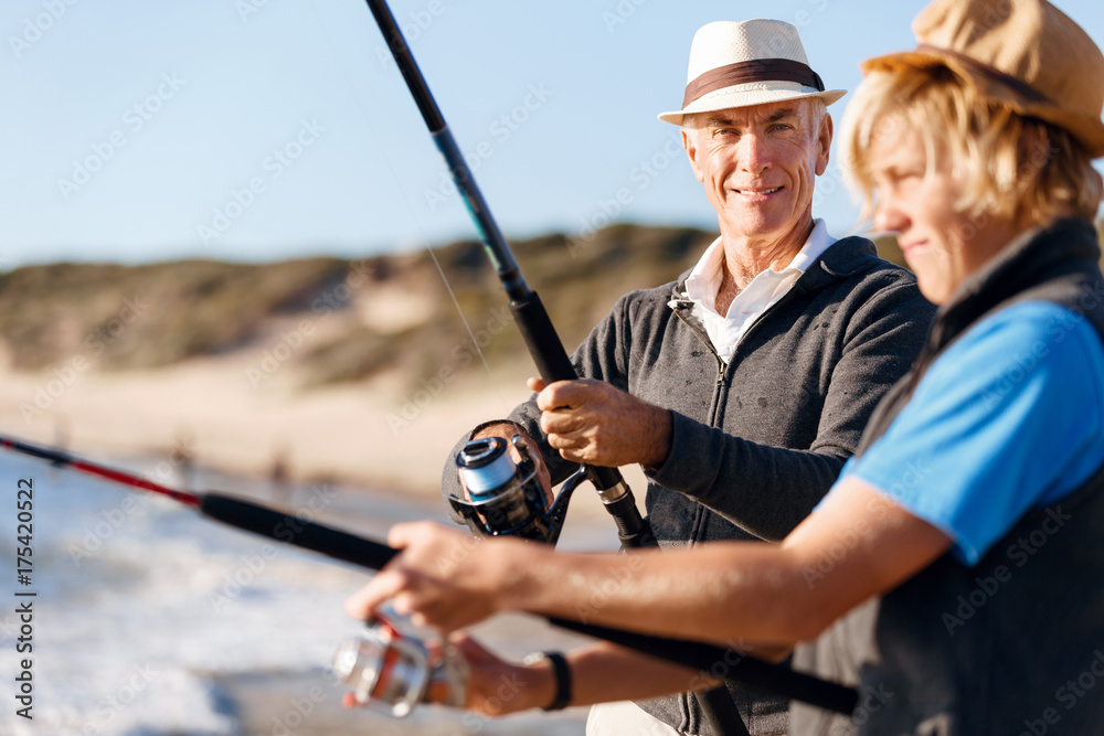 Senior man fishing with his grandson Senior man fishing with his grandson