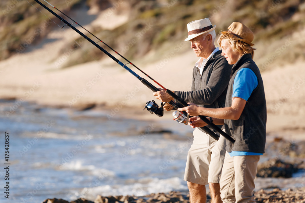 Senior man fishing with his grandson Senior man fishing with his grandson