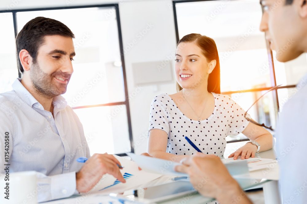 Group of happy young business people in a meeting Group of happy young business people in a meeting