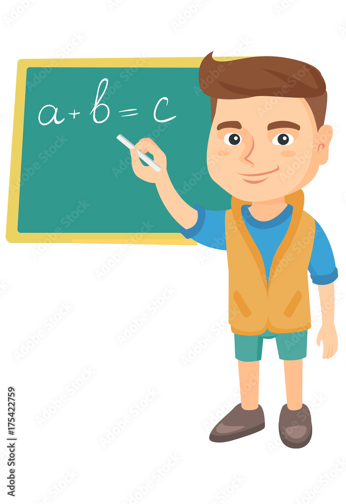 Happy caucasian schoolboy writing mathematical formula on the classroom blackboard
