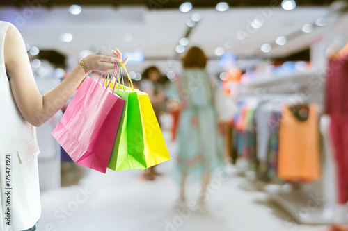 woman holding shopping bag in supermarket mall with copy space ,vintage color