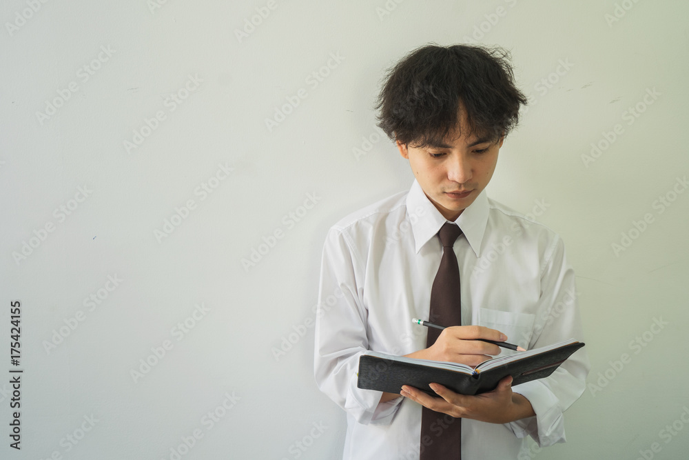 Closeup man hand holding a book to read Closeup man hand holding a book to read