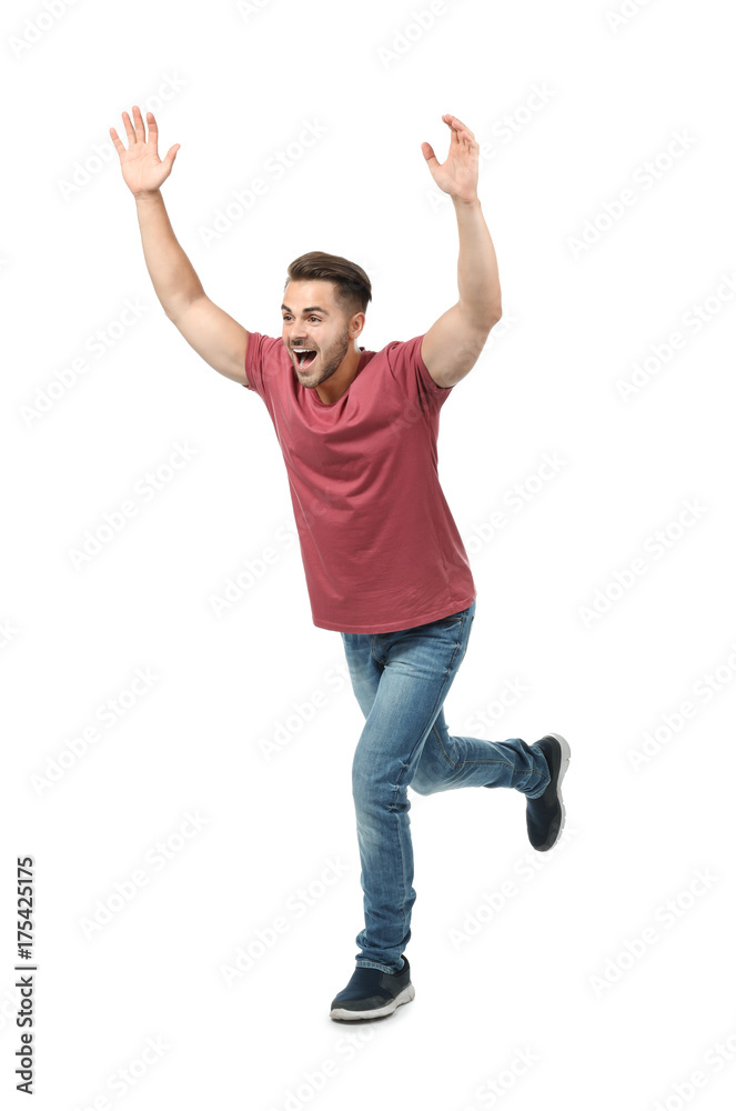 Young man in casual clothes running against white background Young man in casual clothes running against white background