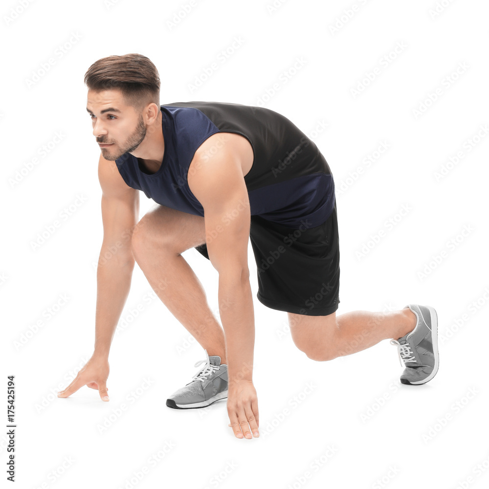 Young man in sportswear preparing to run on white background Young man in sportswear preparing to run on white background