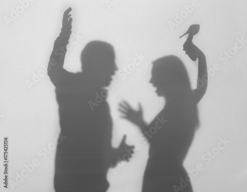 Silhouettes of quarreling m...