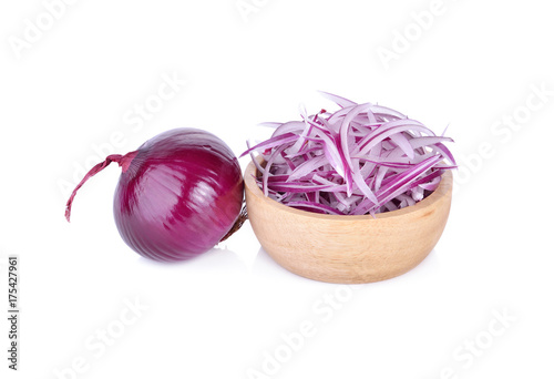 sliced shallot or red onion in wooden bowl and on white background