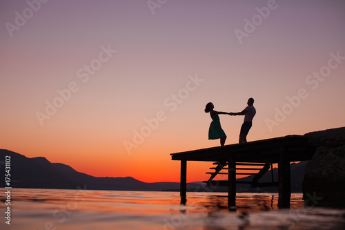 Love story. Couple on the sunset. Summer time. Couple in love. Sensual. Honeymoon, vacation, life, dream. 