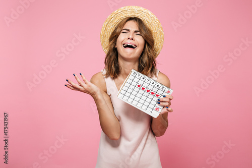 Фотография Portrait of an upset desperate girl in summer hat