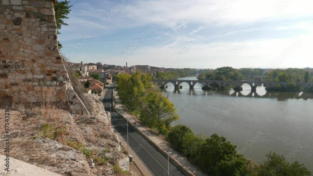 view of the Douro River and the medieval bridge in Zamora, Spain. Pan view of the Douro River and the medieval bridge in Zamora, Spain. Pan