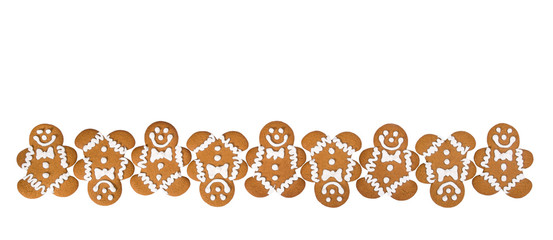 A row of Gingerbread Men cookies isolated on white background border