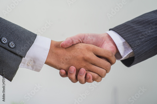 Businessman handshake,businessman shaking hands to seal a deal with his partner 