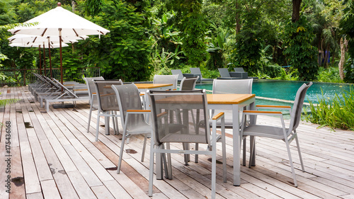 Modern patio next to swimming pool