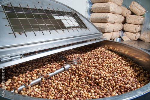 The processing of dry fruit: shelled hazelnuts inside the machine for the peeling and blanching precess