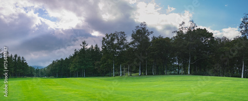 Fototapeta Naklejka Na Ścianę i Meble -  Golf Course where the turf is beautiful and green in Hokkaido, Japan. Golf is a sport to play on the turf	