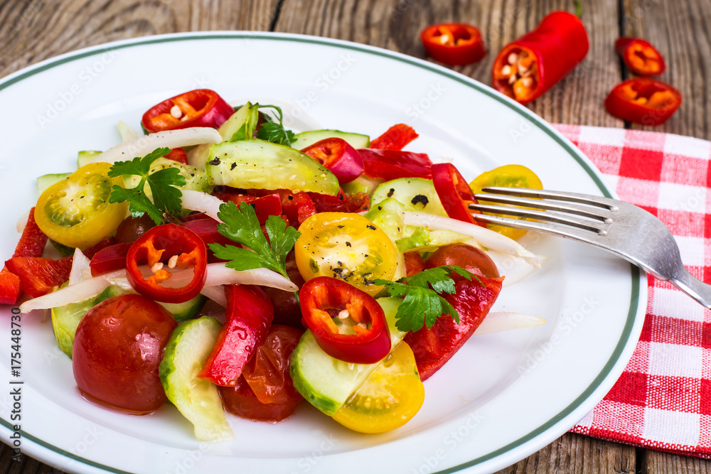 Spicy salad of fresh vegetables with chili