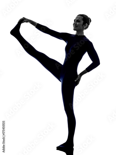 woman exercising Hasta Padangusthasana hand to big toe pose yoga silhouette shadow white background © snaptitude
