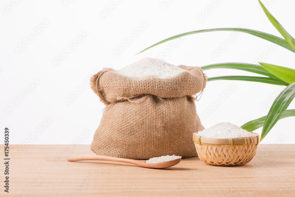 Jasmine white rice in sack isolated on white background Jasmine white rice in sack isolated on white background