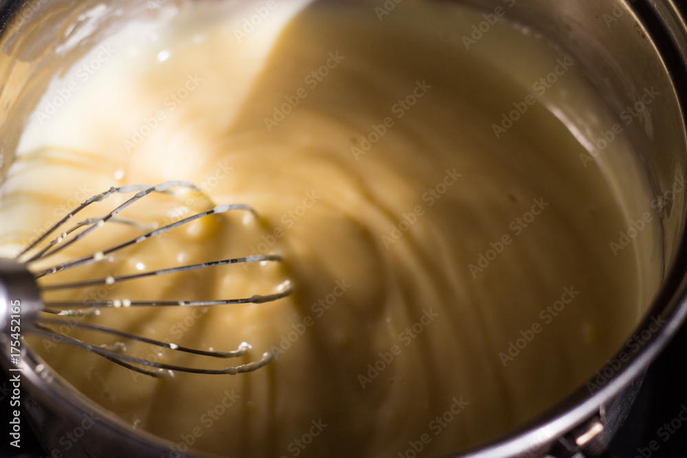 Cooking pie with rhubarb. Preaparing the pudding in the .saucepan. Cooking pie with rhubarb. Preaparing the pudding in the .saucepan.
