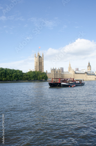 River Thames with Boat and Parliament in Background © pauws99