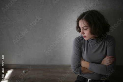 upset woman near wall,depression and loneliness