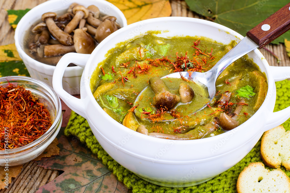 Dishes from mushrooms. Autumn soup with forest mushrooms Dishes from mushrooms. Autumn soup with forest mushrooms