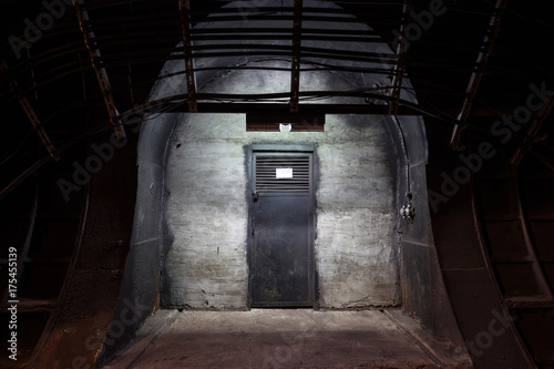 Underground tunnel. Mysterious iron door. Secret entrance.