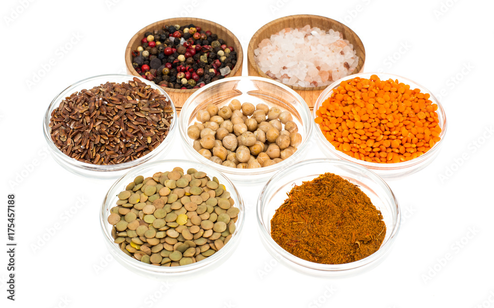 Different bowls with spices, cereals and herbs on white background Different bowls with spices, cereals and herbs on white background