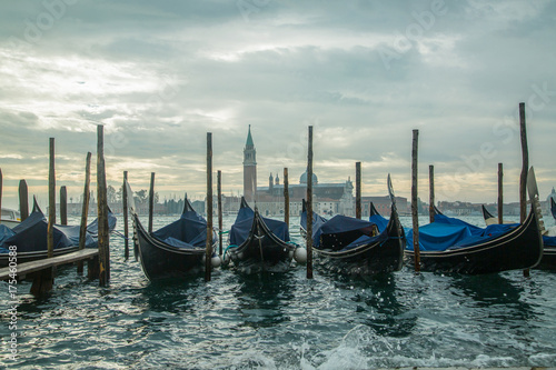 Venice gondola boat stop in front of the city © hin255