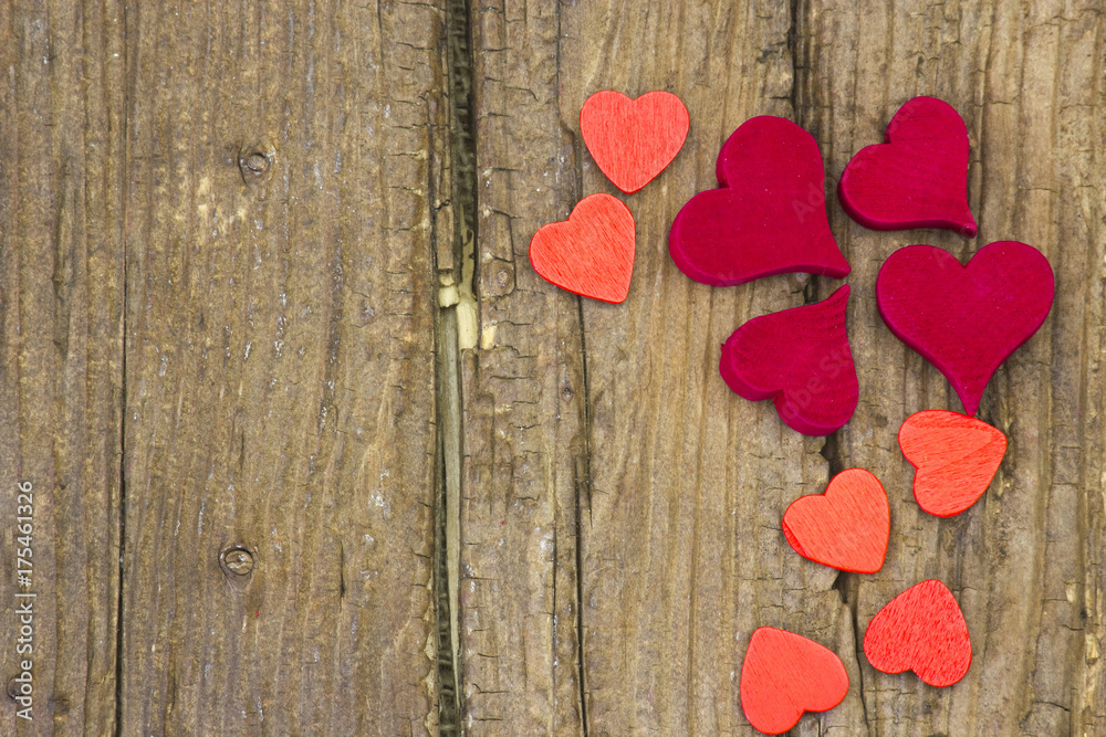 Fototapeta premium red hearts on wooden background