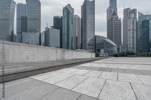 Photography cityscape and skyline of shanghai from empty brick floor.
