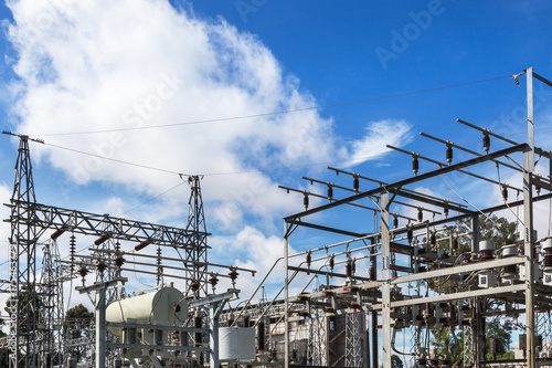  High voltage electrical pylon in electric power plants power substation on blue sky background 